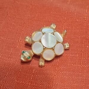 Adorable Goldtone Turtle Brooch With Mother Of Pearl Inlay and Green Glass Eyes